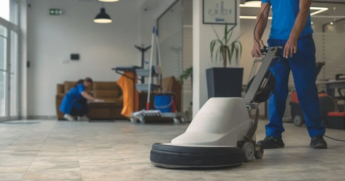 Professional commercial cleaning service in Charlotte, NC using a floor buffer